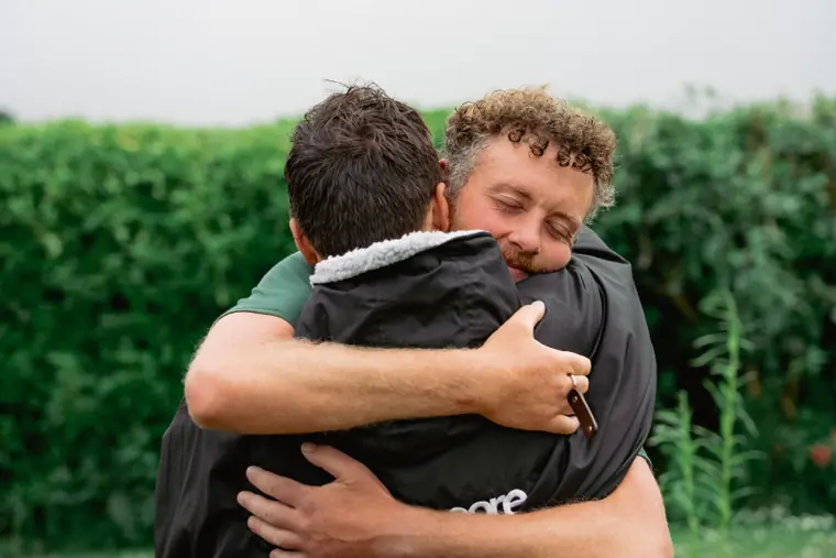Two men embracing