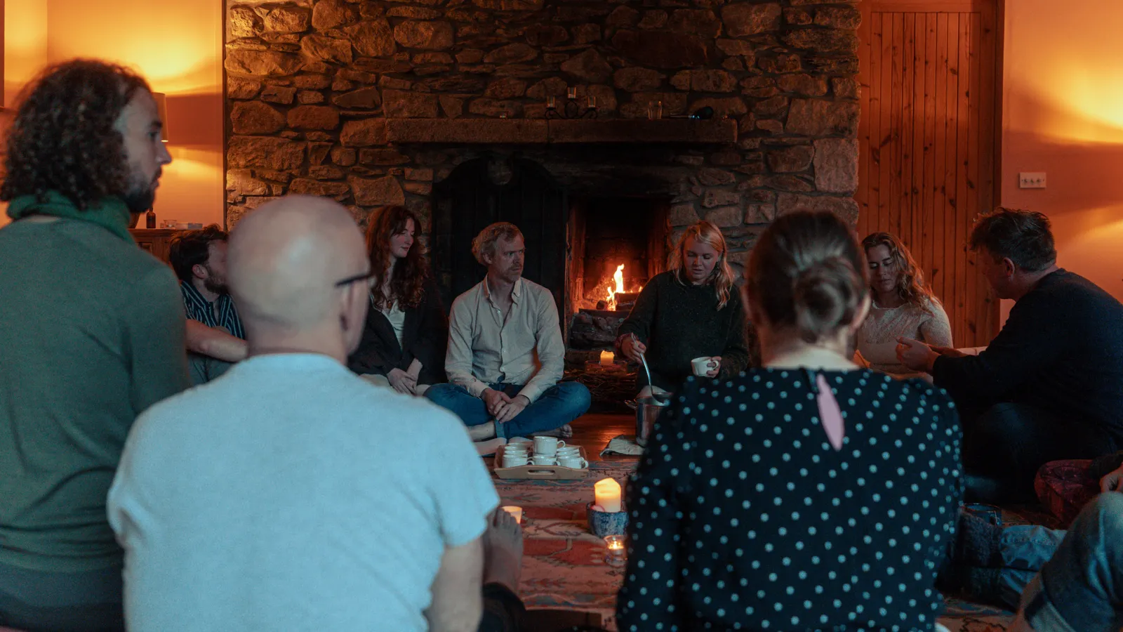 Niall and Michaela with a group by the fire at Mucklagh Lodge