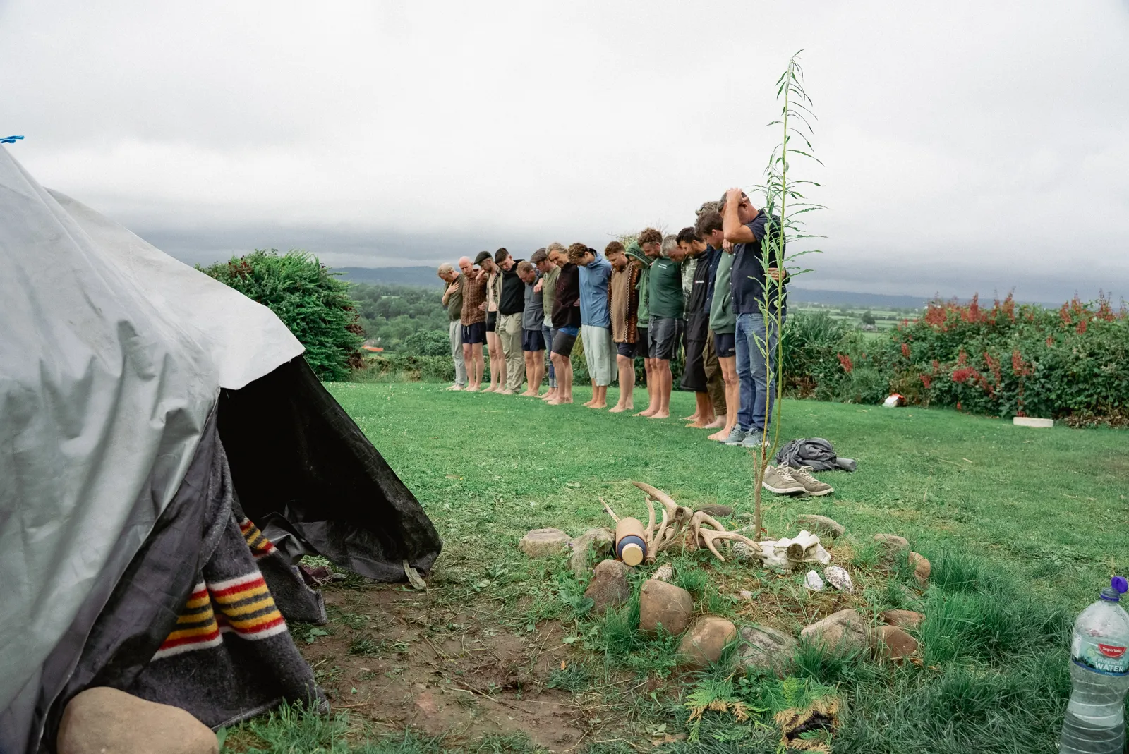 Men gathered at the Teach Allais sweat lodge